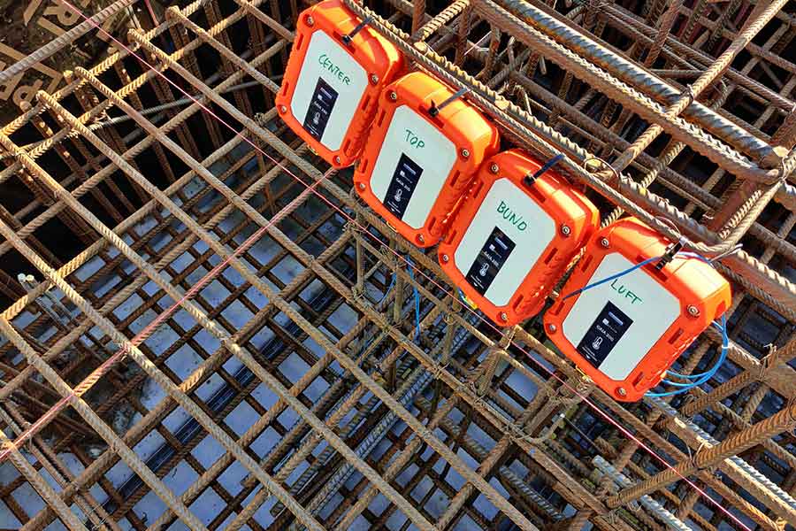 four Gaia 200 transmitters lined up next to each other on a metal structure