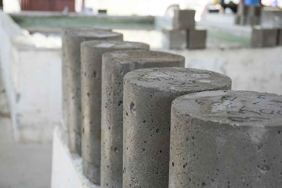 five cylinder concrete slabs in a row