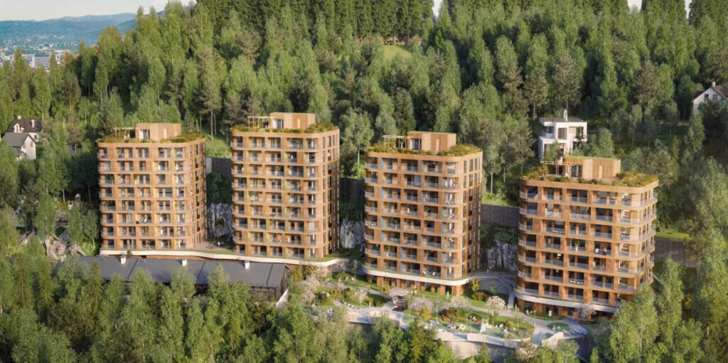 four buildings placed next to each other surrounded by trees