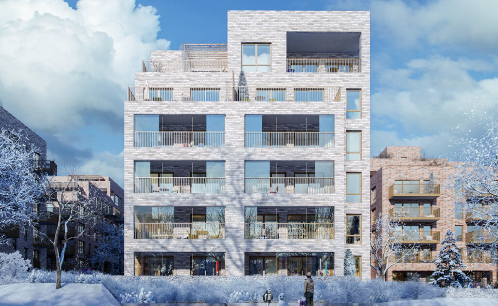 White building complex, with snow on the ground