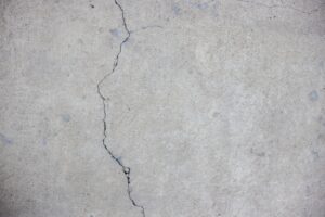 Grey cracked concrete wall